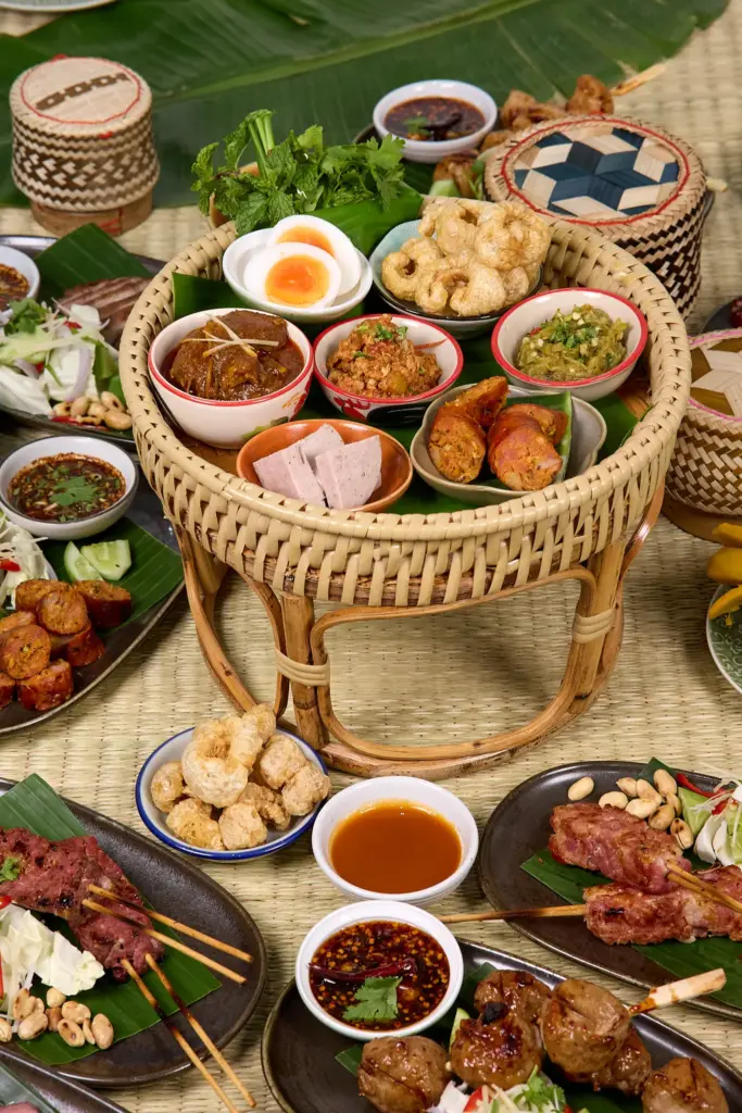 image shows northern thai food on table in nuea mek restaurant, silom, bangkok, thailand