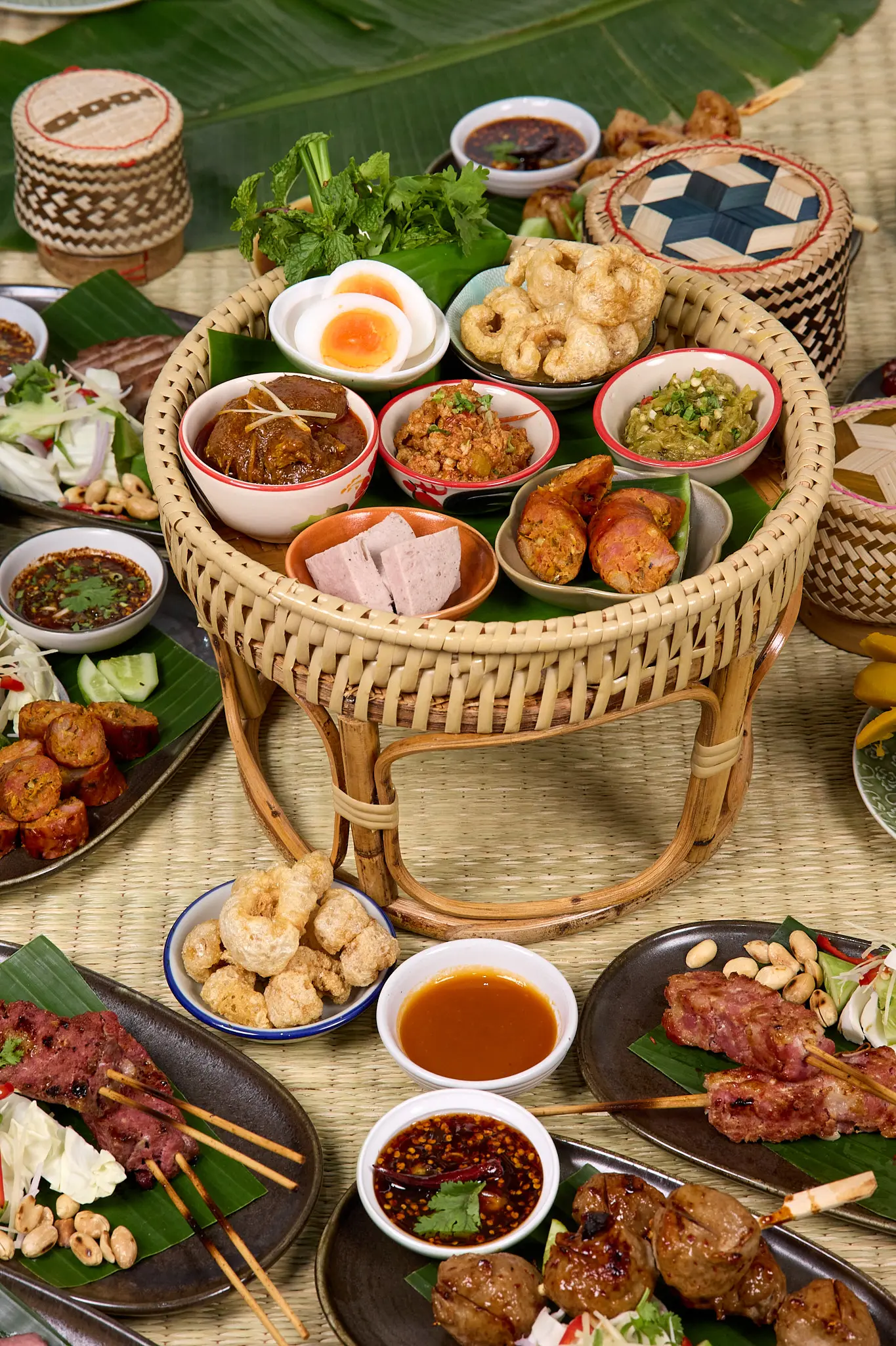 image shows northern thai food on table in nuea mek restaurant, silom, bangkok, thailand