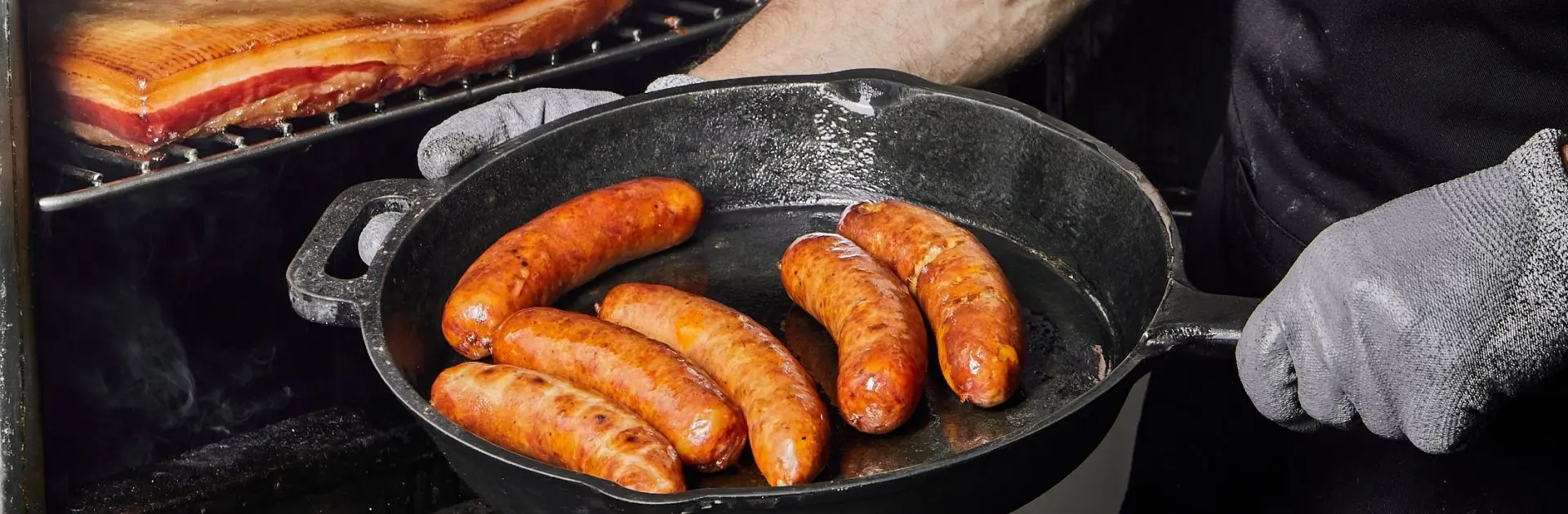 image shows raro pan cooking Sloane's sausages