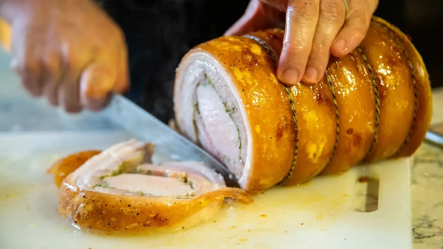 image shows a roasted porchetta